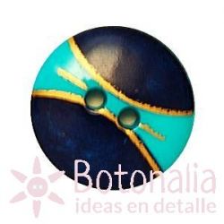 Button with a design in a golden color over blue color.